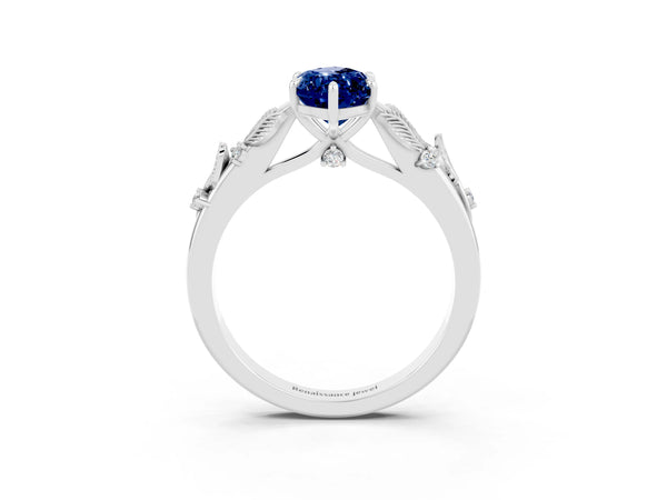 White gold Marquise Cut Blue Sapphire Solitaire Ring with Leaf Motif Band and Four-Prong Setting