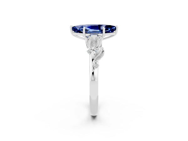 Platinum Marquise Cut Blue Sapphire Solitaire Ring with Leaf Motif Band and Four-Prong Setting