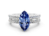White gold Marquise Cut Blue Sapphire Solitaire Ring with Pavé and Channel Set Band