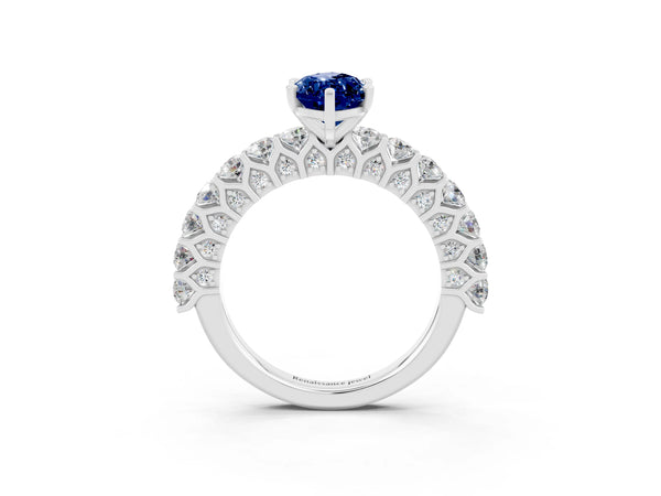 White gold Marquise Cut Blue Sapphire Solitaire Ring with Shared Prong Pavé Band and Four-Prong Setting