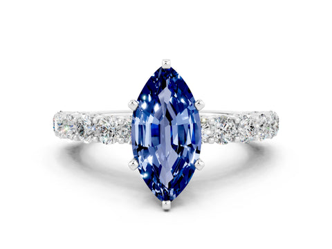 White gold Marquise Cut Blue Sapphire Solitaire Ring with Shared Prong Pavé Band and Four-Prong Setting