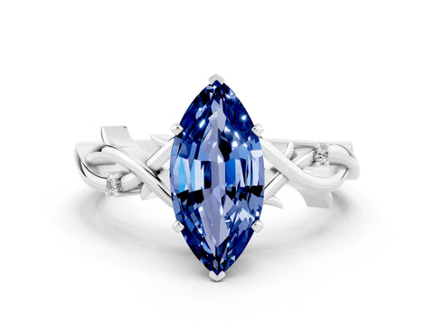 White gold Marquise Cut Blue Sapphire Solitaire Ring with Twisted Band and Prong Setting