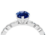 White gold Marquise Cut Blue Sapphire Solitaire with Side Stones on a Pavé Band and Four-Prong Setting_4