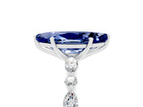 White gold Marquise Cut Blue Sapphire Solitaire with Side Stones on a Pavé Band and Four-Prong Setting_5