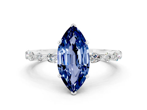 White gold Marquise Cut Blue Sapphire Solitaire with Side Stones on a Pavé Band and Four-Prong Setting