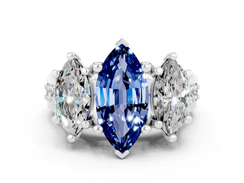 White gold Marquise Cut Blue Sapphire Three-Stone Ring with Channel Set Band and Four-Prong Setting