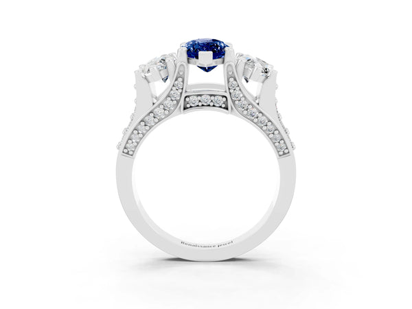 Platinum Marquise Cut Blue Sapphire Three-Stone Ring with Channel Set Band and Four-Prong Setting