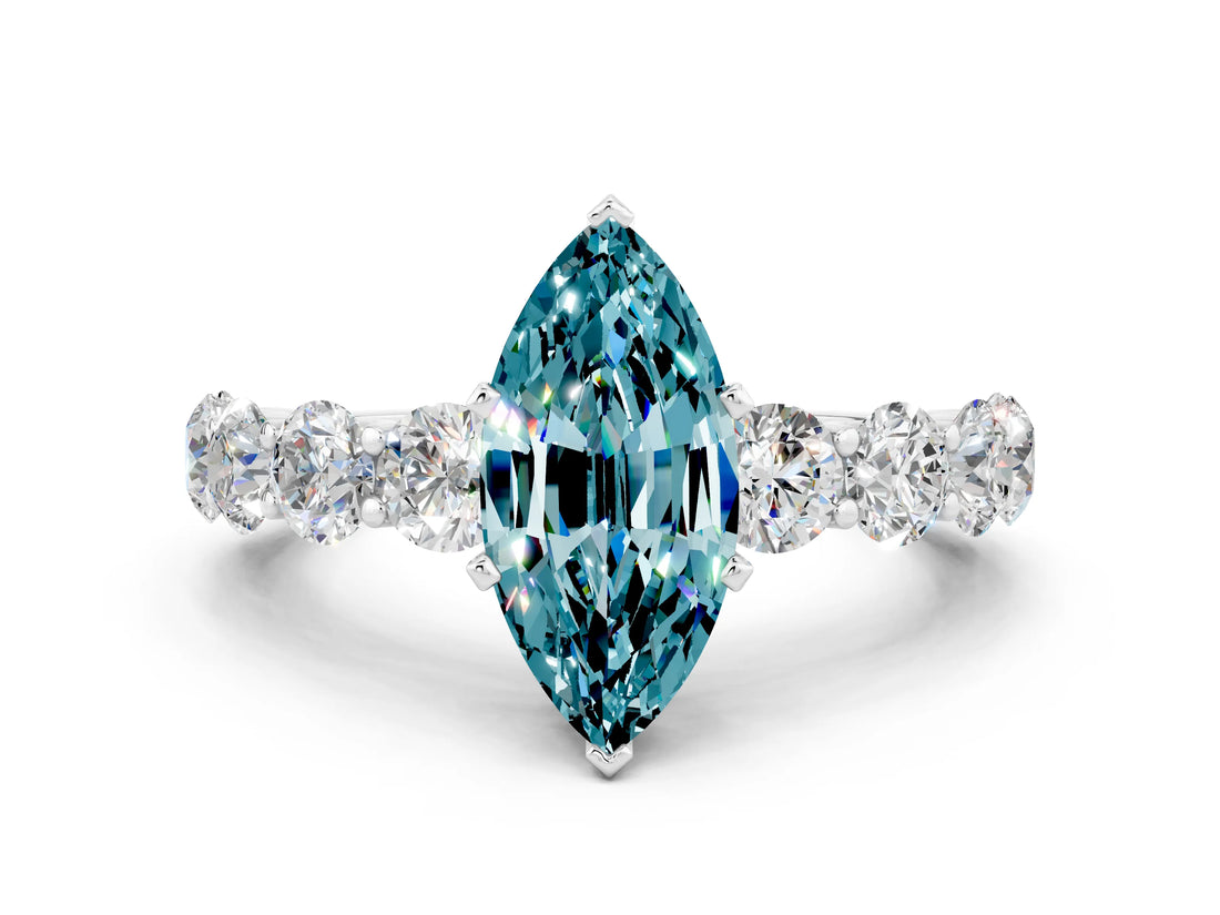 White gold Marquise Cut Blue Topaz Prong Setting with Side Stones on a Pave Band
