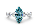 White gold Marquise Cut Blue Topaz Prong Setting with Side Stones on a Pave Band