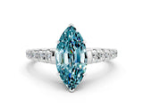 White gold Marquise Cut Blue Topaz Solitaire Ring with Cathedral Setting and Pavé Band