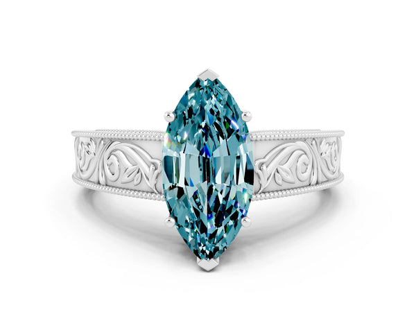 Platinum Marquise Cut Blue Topaz Solitaire Ring with Engraved Band and Four-Prong Setting