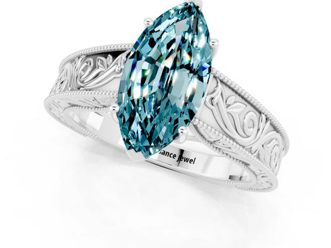 White gold Marquise Cut Blue Topaz Solitaire Ring with Engraved Band and Four-Prong Setting_1