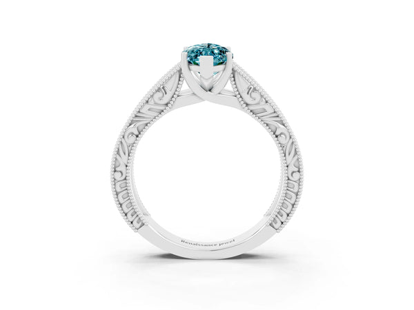 Platinum Marquise Cut Blue Topaz Solitaire Ring with Engraved Band and Four-Prong Setting