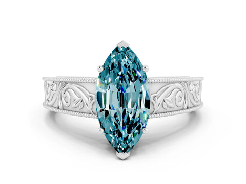 White gold Marquise Cut Blue Topaz Solitaire Ring with Engraved Band and Four-Prong Setting