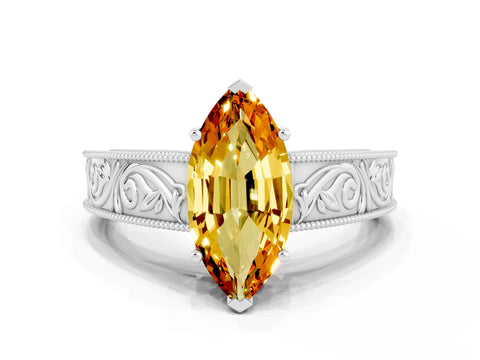 White gold Marquise Cut Citrine Solitaire Ring with Engraved Band and Four-Prong Setting