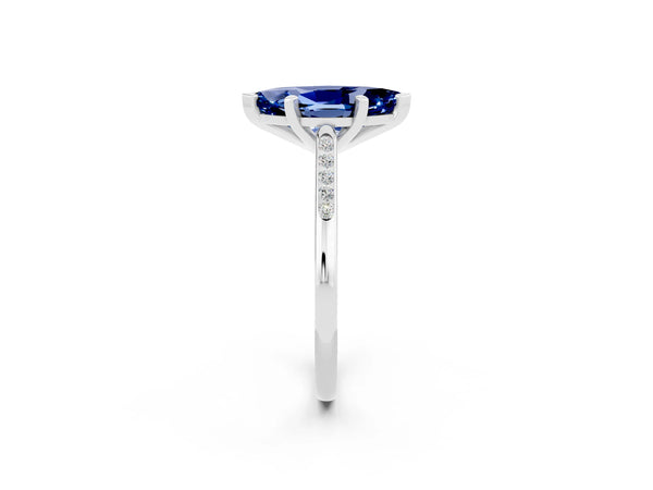 White gold Marquise Cut Blue Sapphire Solitaire Ring with Channel Set Round Band and Prong Setting