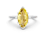 White gold Marquise Cut Cut Channel Set Solitaire Engagement Ring with Four-Prong Setting