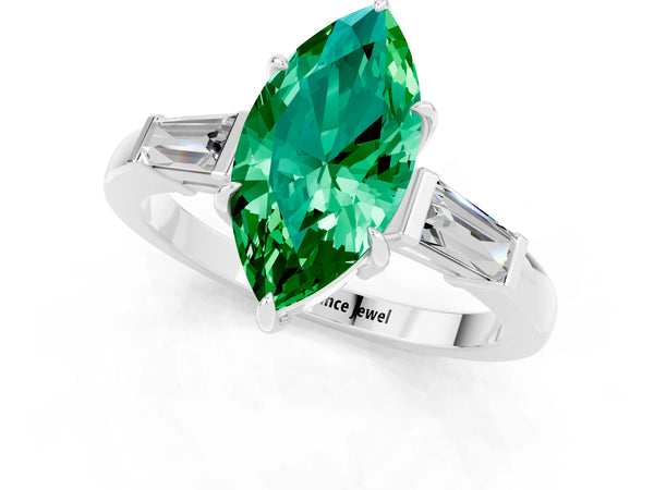 Silver Marquise Cut Emerald Three-Stone Ring with Tapered Baguette Side Stones and Prong Setting