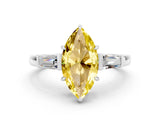 White gold Marquise Cut Cut Diamond Ring with Tapered Baguette Side Stones in Four-Prong Setting