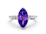 White gold Marquise Cut Cut Diamond Ring with Tapered Baguette Side Stones in Four-Prong Setting