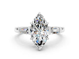 White gold Marquise Cut Cut Diamond Ring with Tapered Baguette Side Stones in Four-Prong Setting