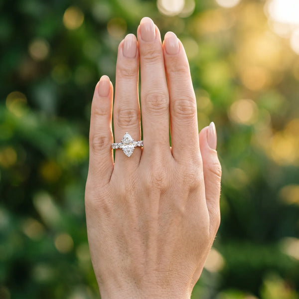 White gold Marquise Cut Diamond Prong Setting with Side Stones on a Pave Band