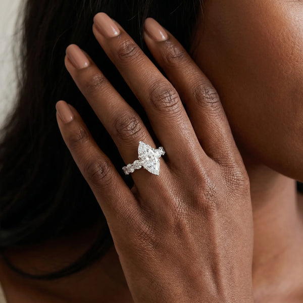 White gold Marquise Cut Diamond Prong Setting with Side Stones on a Pave Band