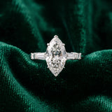 White gold Marquise Cut Diamond Ring with Baguette Side Stones, Channel Set Band, and Four-Prong Setting_60