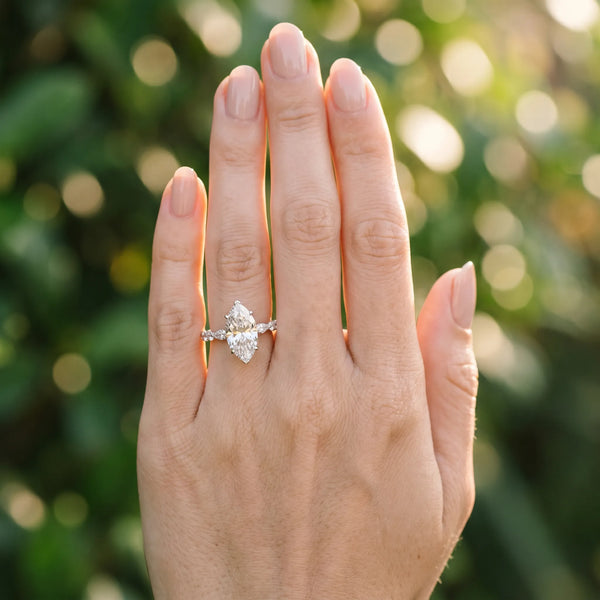 10K White Gold 1.01 Carat D VVS2 Marquise Diamond Ring with Marquise and Round Side Stones and Four-Prong Setting