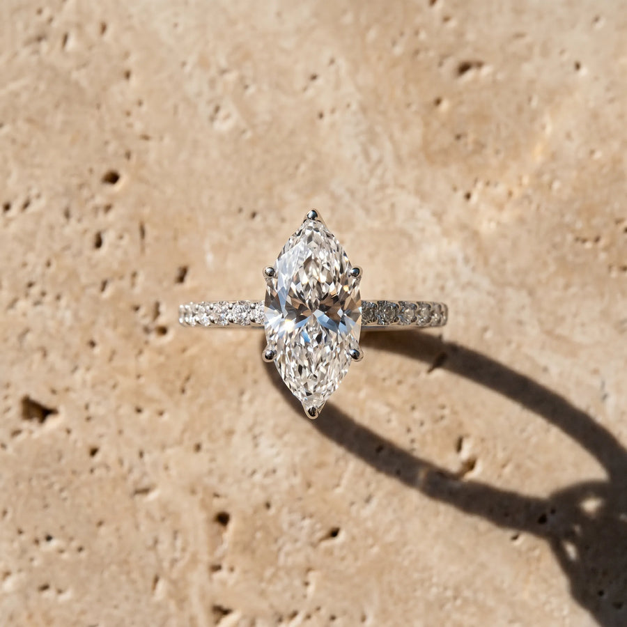 White gold Marquise Cut Diamond Solitaire Engagement Ring with Round  Pavé Band and Prong Setting