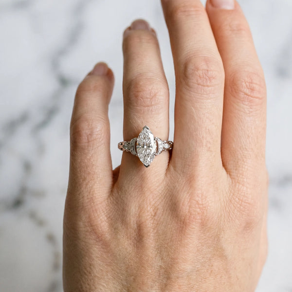 Platinum Marquise Cut Diamond Solitaire Ring with Filigree Band and Four-Prong Setting