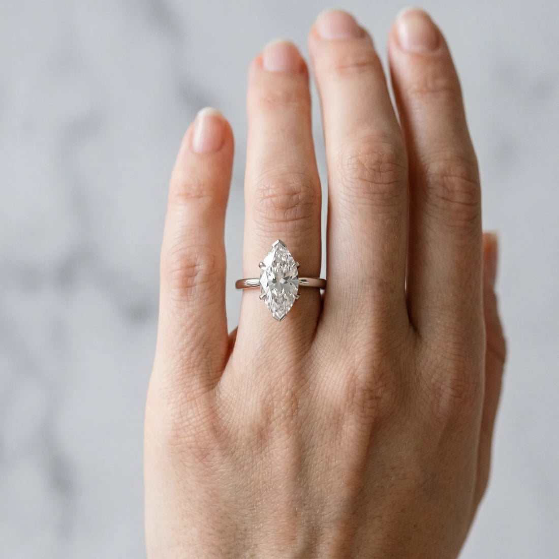 White gold Marquise Cut Diamond Solitaire Ring with Flower Prong Setting and Classic Band_402