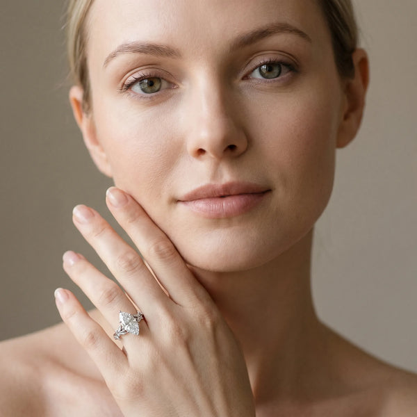White gold Marquise Cut Diamond Solitaire Ring with Leaf Motif Band and Four-Prong Setting