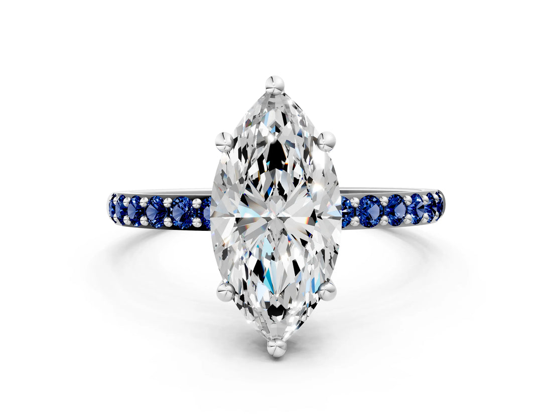White gold Marquise Cut Diamond Solitaire Ring with Round with Blue Sapphire side stone Pavé Band and Prong Setting