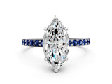 White gold Marquise Cut Diamond Solitaire Ring with Round with Blue Sapphire side stone Pavé Band and Prong Setting
