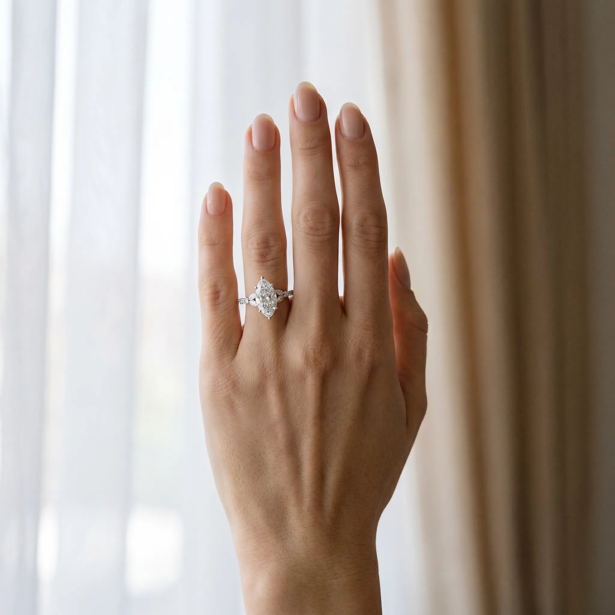 White gold Marquise Cut Diamond Solitaire Ring with Side Stones and Four-Prong Setting_112
