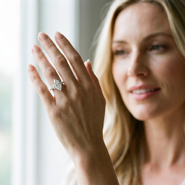 White gold Marquise Cut Diamond Solitaire Ring with Side Stones and Four-Prong Setting