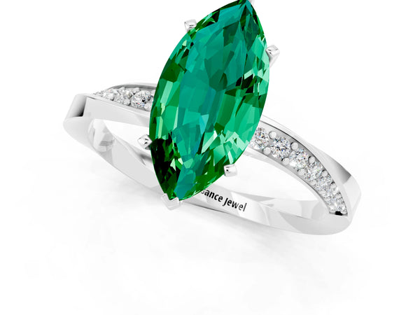 White gold Marquise Cut Emerald Engagement Ring with Side Stone Accents and Four-Prong Setting