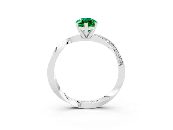 White gold Marquise Cut Emerald Engagement Ring with Side Stone Accents and Four-Prong Setting