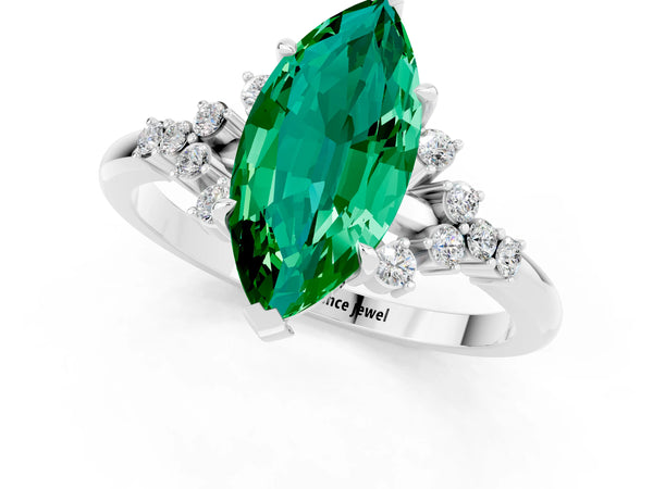 Silver Marquise Cut Emerald Ring with Side Stones and Four-Prong Setting