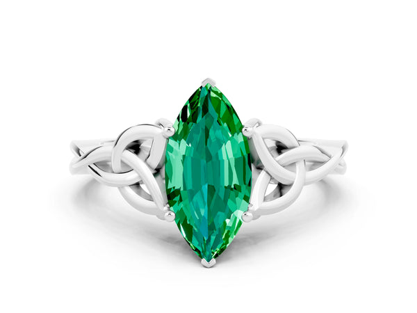 Platinum Marquise Cut Emerald Solitaire Engagement Ring with Celtic Knot Band and Four-Prong Setting
