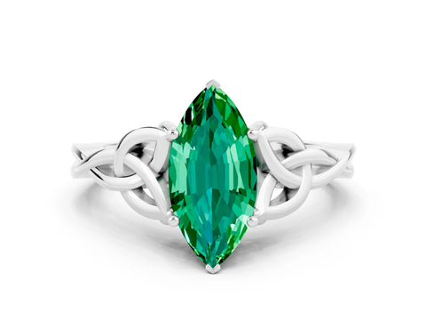 White gold Marquise Cut Emerald Solitaire Engagement Ring with Celtic Knot Band and Four-Prong Setting