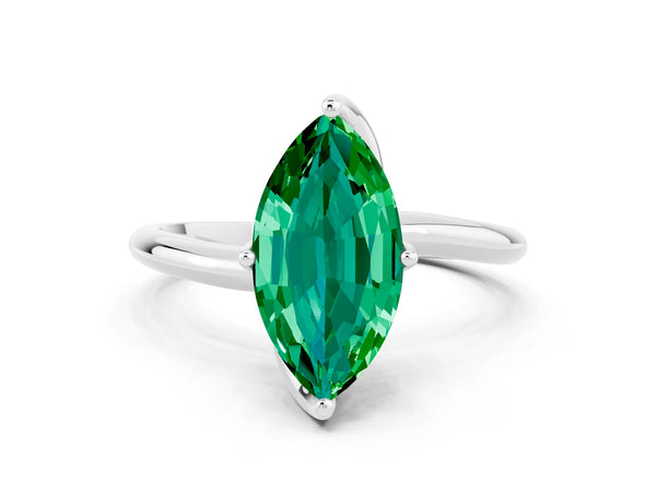 Silver Marquise Cut Emerald Solitaire Engagement Ring with Four-Prong Setting and Classic Band