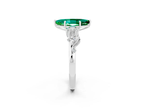 White gold Marquise Cut Emerald Solitaire Ring with Leaf Motif Band and Four-Prong Setting