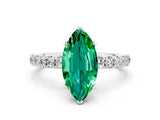 White gold Marquise Cut Emerald Solitaire Ring with Pavé Accents and Four-Prong Setting