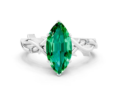White gold Marquise Cut Emerald Solitaire Ring with Twisted Band and Prong Setting