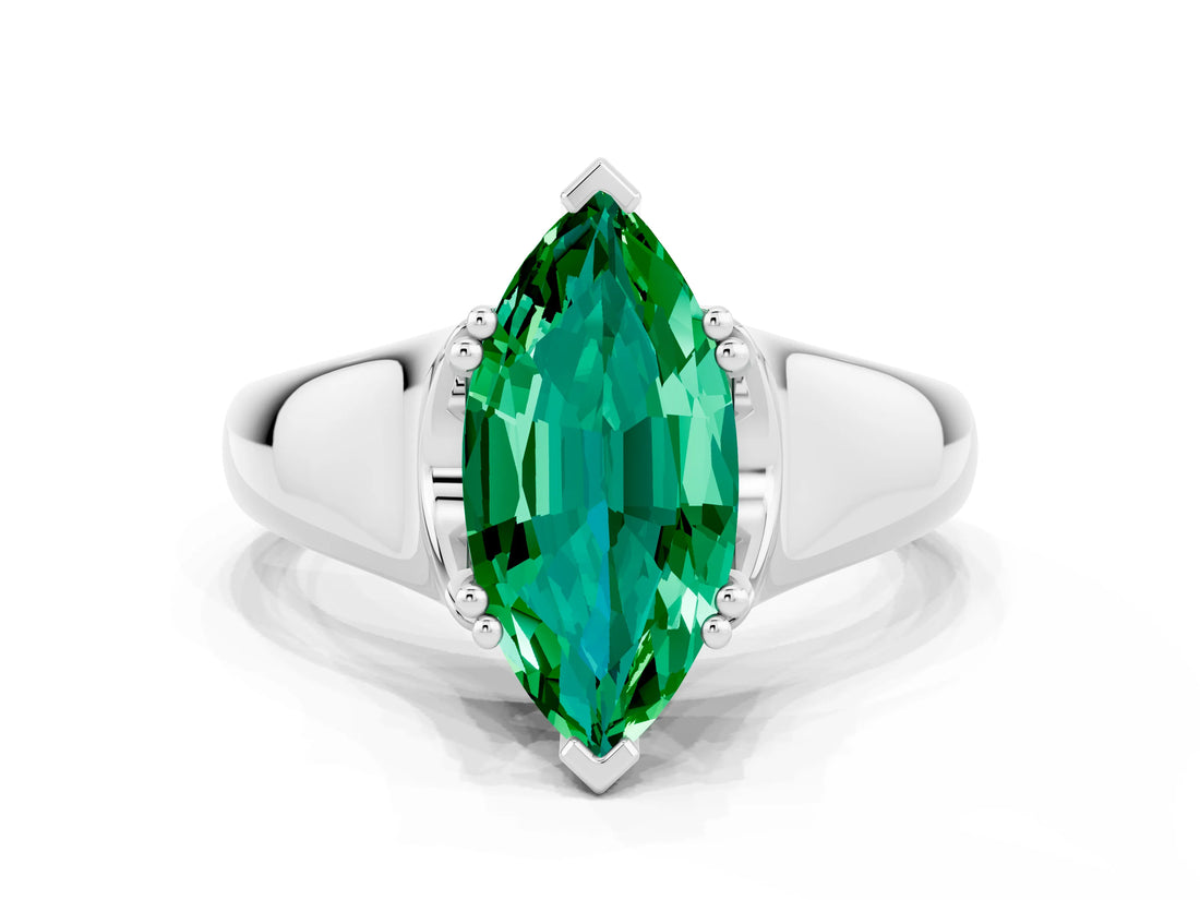 White gold Marquise Cut Emerald Solitaire Ring with Wide Band and Prong Setting