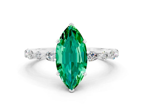 White gold Marquise Cut Emerald Solitaire with Side Stones on a Pavé Band and Four-Prong Setting