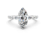 White gold Marquise Cut Moissanite Solitaire with Side Stones on a Pavé Band and Four-Prong Setting