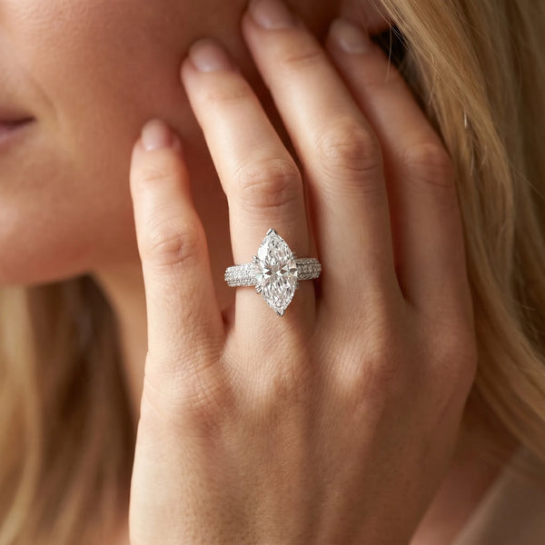 White gold Marquise Cut Pave Diamond Engagement Ring with Channel Set Band and Four-Prong Setting